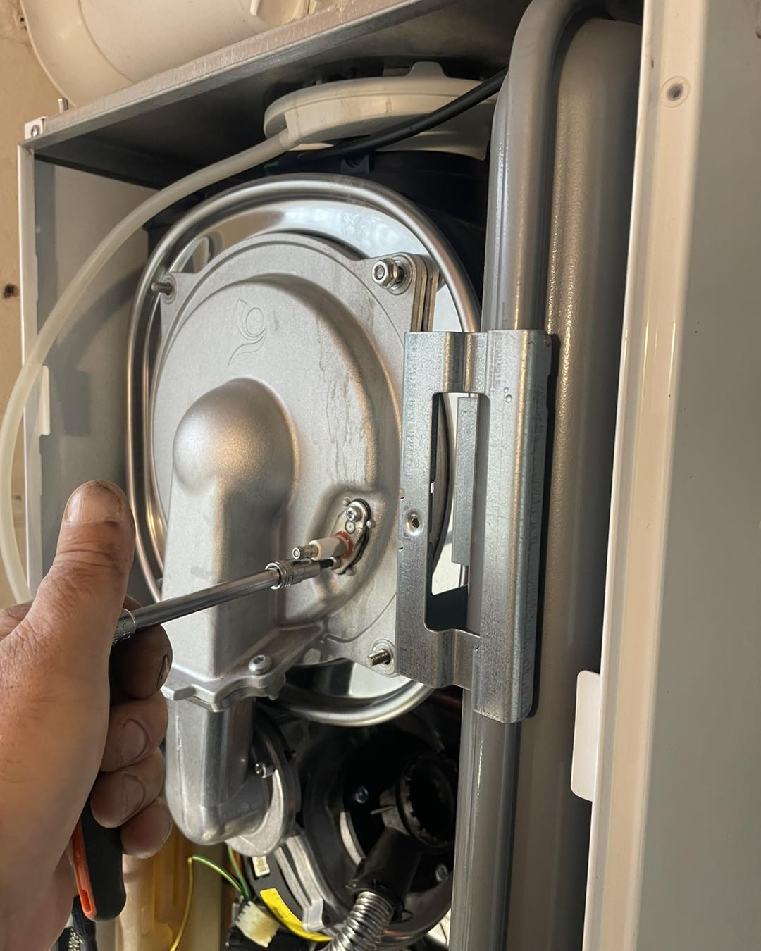 Checking the heat exchanger during an annual boiler service